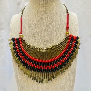 Bronze, black, and red statement piece
